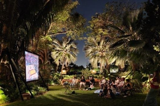 Team member setting up AV equipment at event